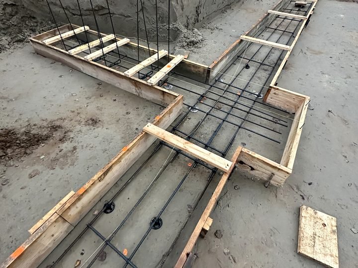 Footing forms laid out inside an excavation